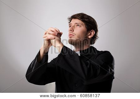 Priest Is Praying