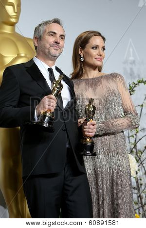 LOS ANGELES - MAR 2:  Alfonso Cuaron, Angelina Jolie at the 86th Academy Awards at Dolby Theater, Hollywood & Highland on March 2, 2014 in Los Angeles, CA