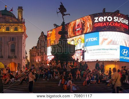 LONDON, UK - AUGUST 22, 2014: Piccadilly Circus in night. Famous place for romantic dates. Square wa