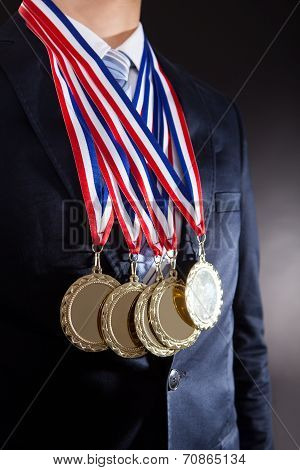Businessman Wearing Gold Medals