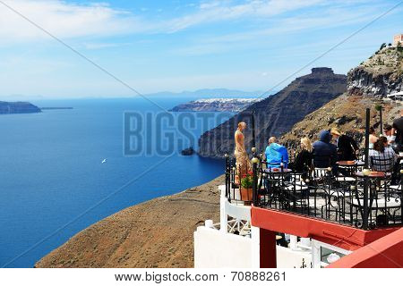 Fira, Greece - May 17: The View On Fira Town And Tourists Enjoying Their Vacation On May 17, 2014 In