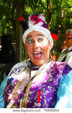 MUSKOGEE, OK - MAY 24: Women dressed in historical costume enjoys her day at the Oklahoma 19th annual Renaissance Festival on May 24, 2014 at the Castle of Muskogee in Muskogee, OK. 