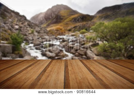 View Of Tryfan Looking Up Ogwen Falls In Autumn Fall With Wooden Planks Floor