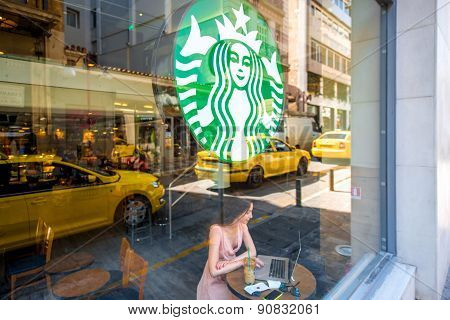Woman in Starbucks cafe