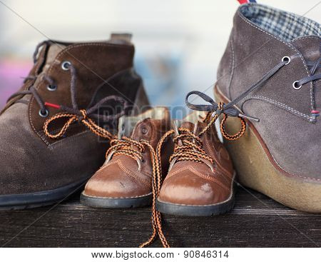 Shoes tied together mom and dad's son. The symbol of family love