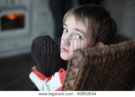 Portrait of beautiful thoughtful little boy with attentive look