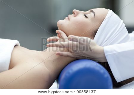 Young woman getting a massage in a spa