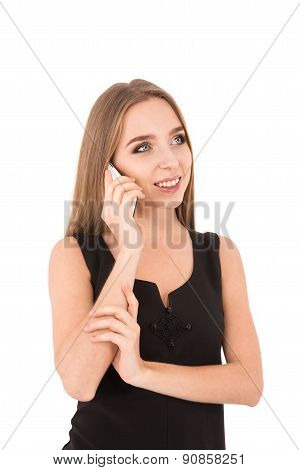 Girl In A Black Dress On A White Background. Girl Talking On The Phone