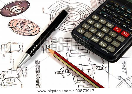Scientific calculator, Pen and Pencil over the Engineering Drawing Map
