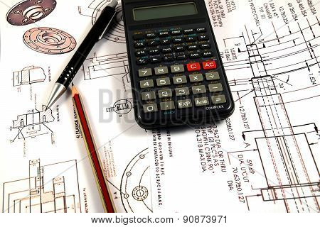 Scientific calculator, Pen and Pencil over the Engineering Drawing Map