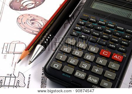 Scientific calculator, Pen and Pencil over the Engineering Drawing Map