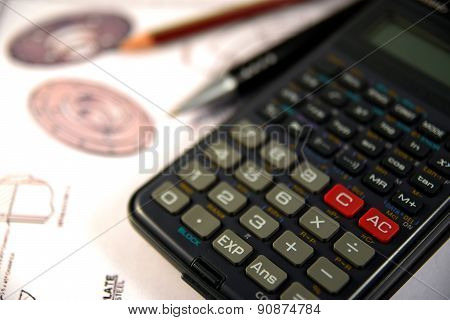 Scientific calculator, Pen and Pencil over the Engineering Drawing Map