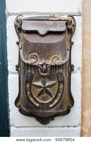A Traditional Post Box In A Wall