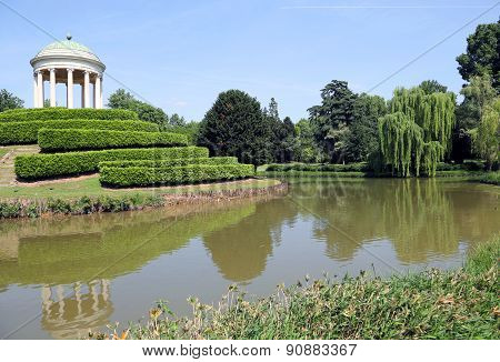 Pond In The Public Garden With Century-old Trees And Ancient Temple