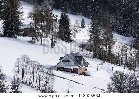 Frosty Snowy Country With Houses In A Sunny Winter Day
