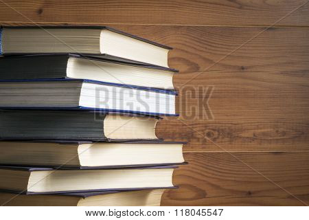 Old book on wooden background.