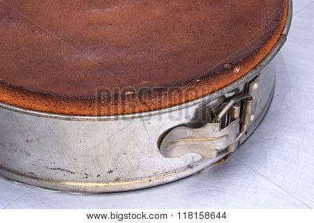 Close up of metal springform with fresh cake