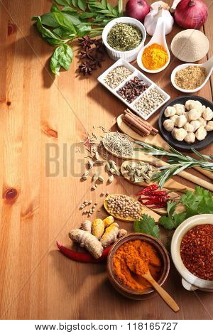 assorted spices and herb on the wooden table