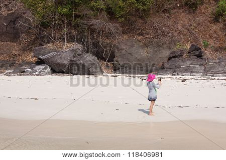 Tourists On The White Sand Beach