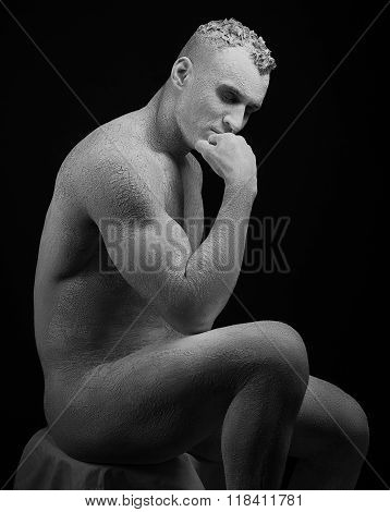 Statue And Makeup Body Topic: Inflated Man With Big Muscles Painted In White Paint Is Cracked On A D