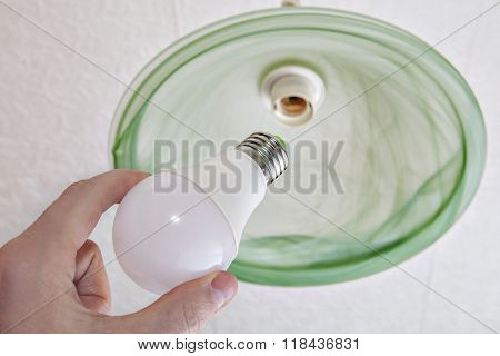 Close-up Of Energy-saving Led Light Bulb In Human Hand.