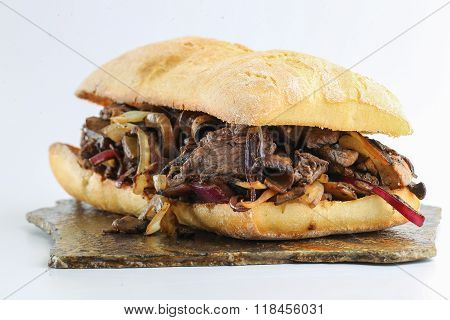 Tasty beef steak onion mushroom sandwich
