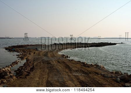 Pylons and track flooded by lake near Lokbatan, Azerbaijan