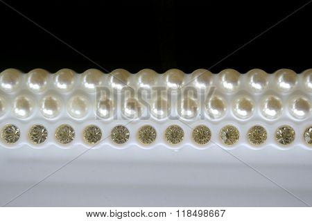Diamante and pearl frame line on black nackground