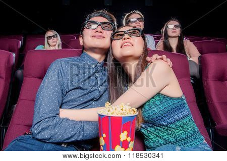 People in the cinema wearing 3d glasses