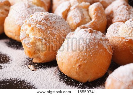 Fried Donuts Castagnole Macro On A Black Plate. Horizontal