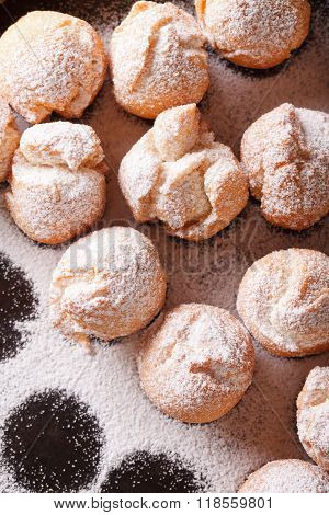 Italian Street Food: Fried Castagnole Close-up. Vertical Top View