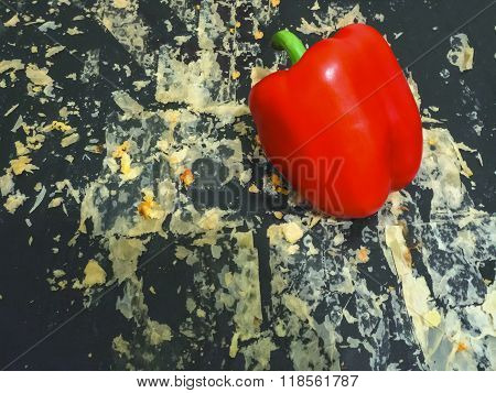Baking tray with crumbs and red paper