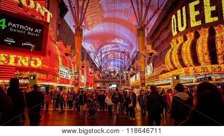 Tourist Cross The Road At Fremont Street At Night In Las Vegas
