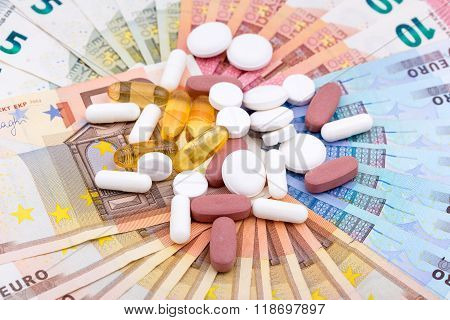 Pills and capsules on money