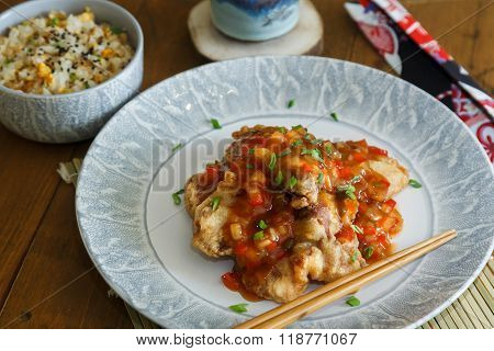 Sweet And Sour Pork And Rice On Plate With Chopsticks, Chenese Cuisine