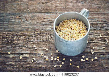 chick-pea a metal mug on wooden background
