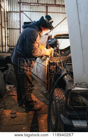 Mechanic repair and service car in garage