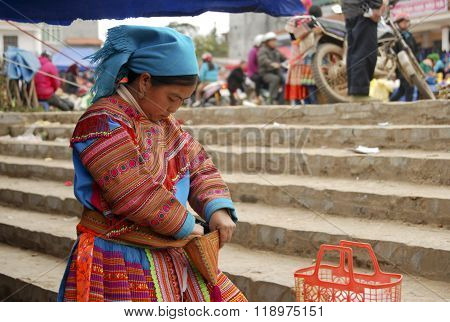 LAOCAI, VIETNAM, FEBRUARY 12, 2012: H'mong ethnic minority people in Bac Ha traditional market. H'mong is the 8th largest ethnic group in Vietnam.