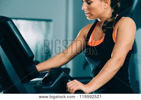 Woman Exercising On Treadmill