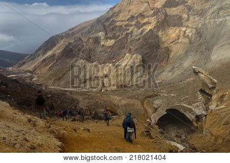 Kamchatka Peninsula, Russia - August 26, 2016: Tourists during the ascent to the active volcano Mutnovsky in Kamchatka.