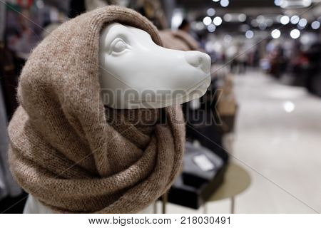 HELSINKI, FINLAND - DECEMBER 9, 2017: Dummy of dog dressed in snood in the Stockmann department store. 2018 is year of the dog by Chinese horoscope