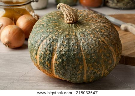 Fresh picked whole pumpkin Courge Delica Moretti in the kitchen