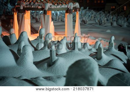 Mystical graveyard memorial in winter snow night
