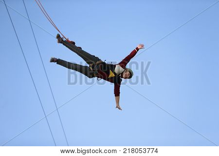 Belarus Gomel May 01 2017.Jumping with a rope.Woman jumping from the tower.Engage in extreme sports.