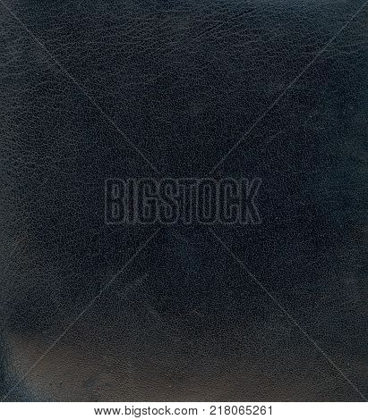 Black leather background textured with graining patterns