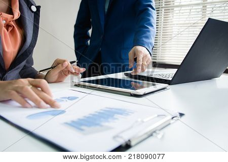 Business And Finance Investment Concept. Businessman Calculate About Cost And Doing Finance At Offic