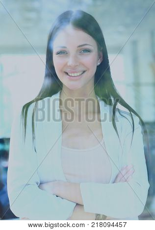 business woman looking thtough window in the office