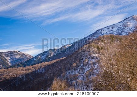 Winter mountain landscape with rocks and snow in Russia
