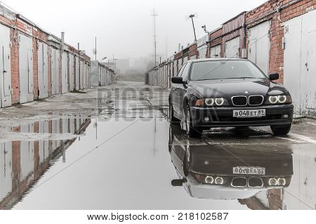 Novyy Urengoy Russia - June 6 2015: Motor car BMW E39 520i in the city street.