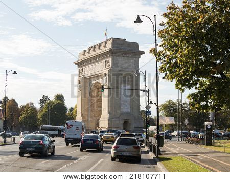 Bucharest Romania October 10 2017 : The Arch Of Triumph - 26m granite arch built in memory of WWI troops with internal stairs for city views щт еру Arc de Triomphe Square in Bucharest city in Romania
